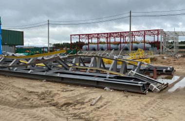 under construction building including metal roof structure and concrete pillar also scaffold